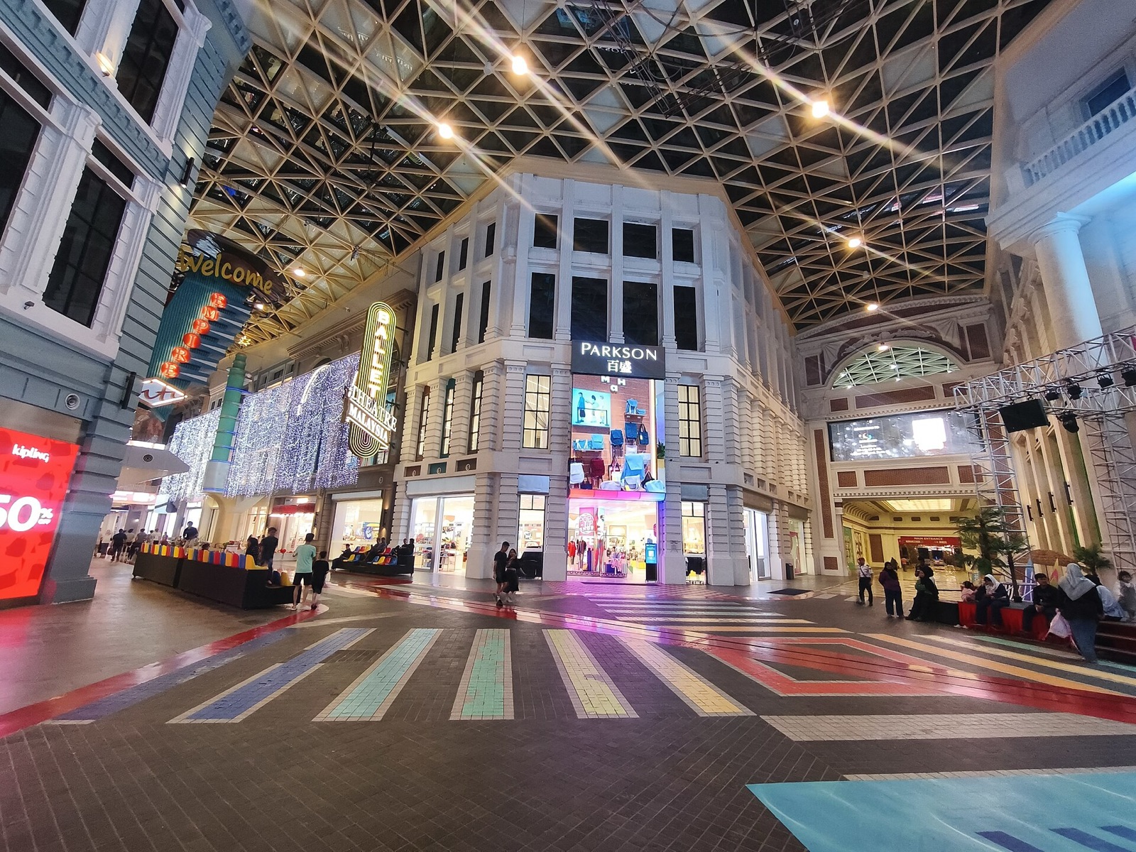 A covered European-style street and the Parkson store inside Hextar World.