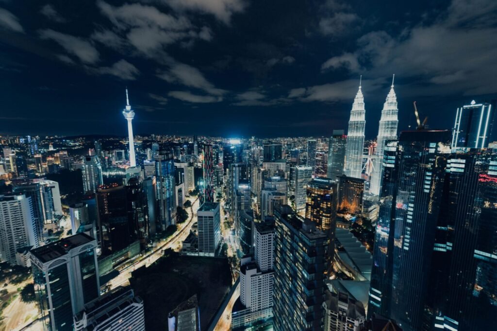 MM2H tier investment Kuala Lumpur skyline Petronas Towers at night Malaysia 2026